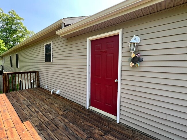 Building Photo - Spacious 3BR Duplex with Finished Basement & 2-Car Garage in Otsego