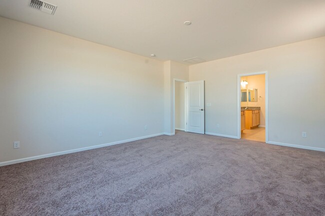 Building Photo - Beautiful New Spacious Home Includes 3 car...