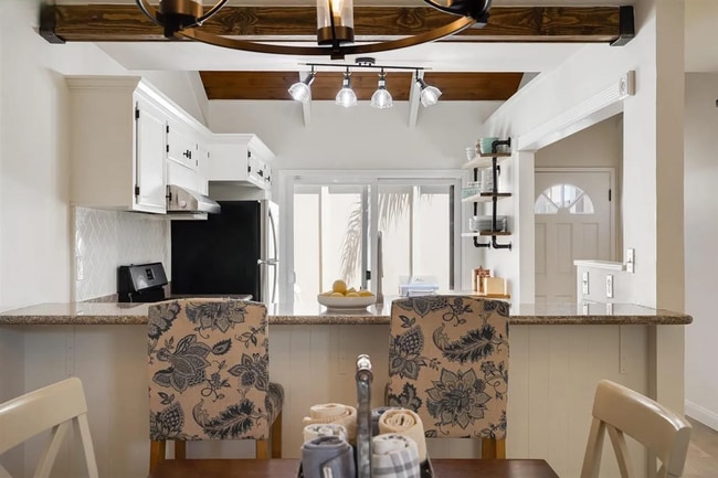 Building Photo - Spacious 1,550 Sq Ft Townhome | 2-Car Garage & High Ceilings w/ Exposed Beams