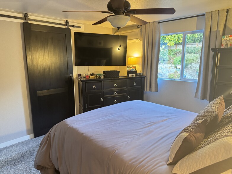 Primary room with barn door for primary bath - 932 22nd Ave S