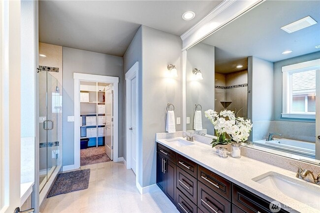 Building Photo - Luxury NW Living: 4 Bedroom Masterpiece with Dual Suites and Private Yard in Desirable Browns Point!