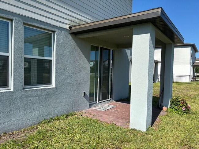 Building Photo - Like-New 4 Bedroom 3 Bath with Pond View & Two Living Spaces — Minutes to South Lake Nona