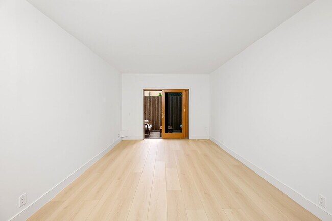 Downstairs bedroom 2 with access to outdoor patio and powder room - 518 Euclid St