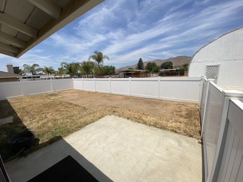 Part of backyard with vinyl fence for personal touch - 8483 Red Mesa Dr