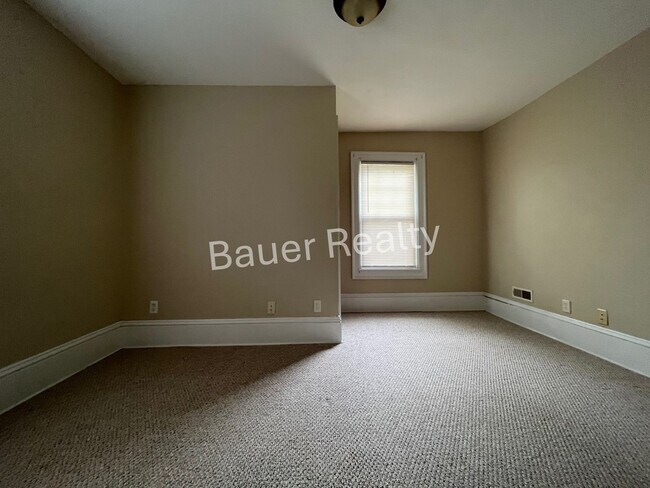 Building Photo - Three bedrooms, one and a half baths