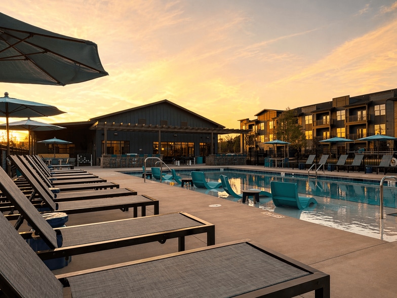 Resort-style pool featuring a baja shelf and expansive sundeck for lounging. - Cypress Point