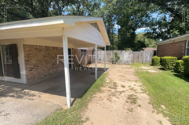 Building Photo - Brick Home with Carport
