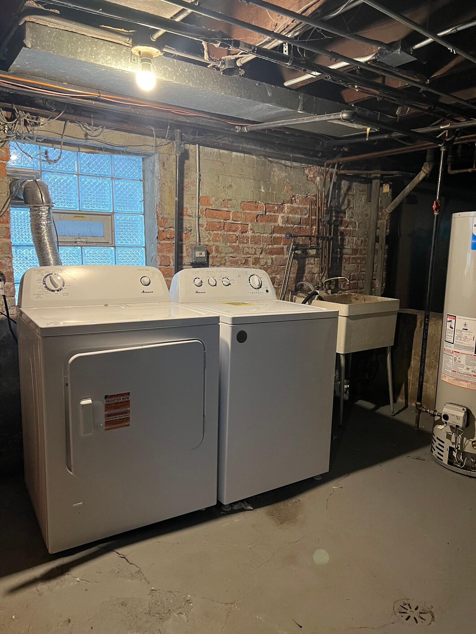 free laundry in front house basement 20 feet across courtyard - 2446 W Thomas St