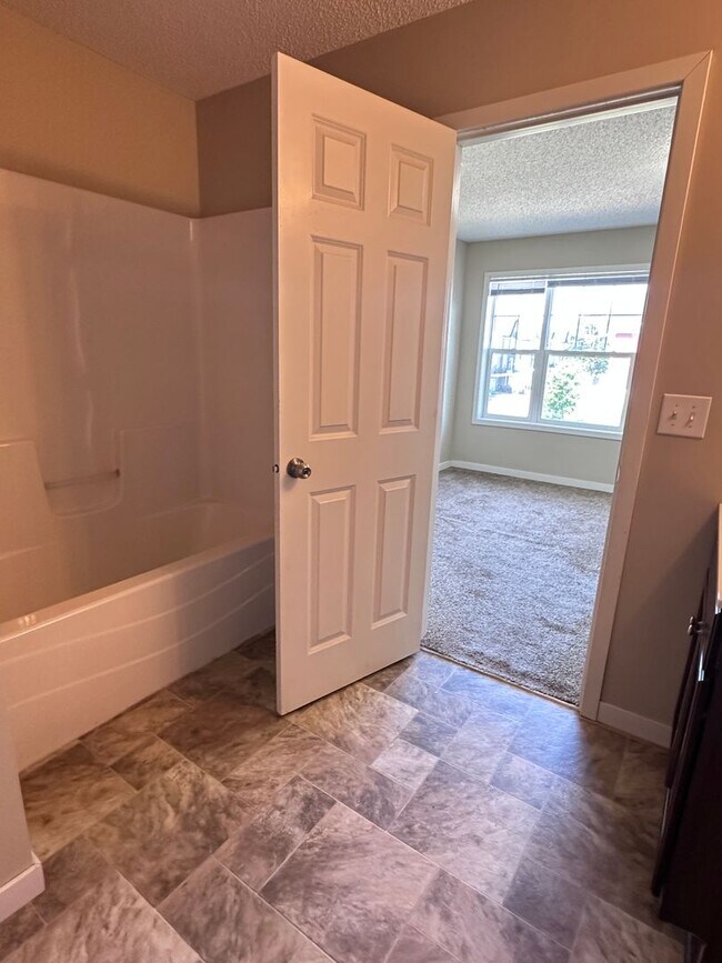 Building Photo - Champlin Corner Unit Town Home, 2 Car Garage, Dishwasher, Washer/Dryer, Balcony