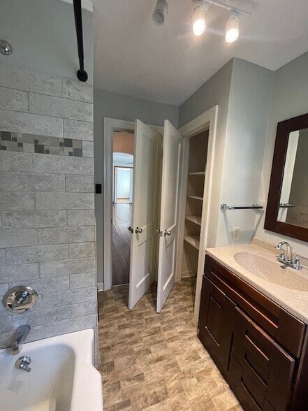 Linen closet in bathroom - 1409 N Woodburn Ave