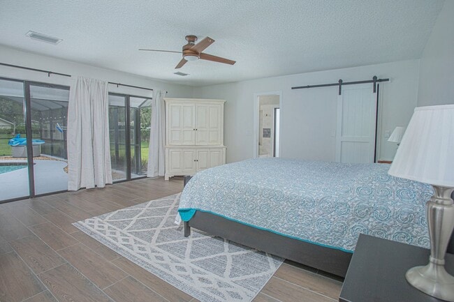 Building Photo - Beautifully Updated 3/2 Pool Home with Large Backyard in Lake Ajay (Gated Community)