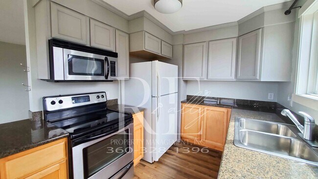 Building Photo - Modern Manette 1BR Condo with Private Pati...