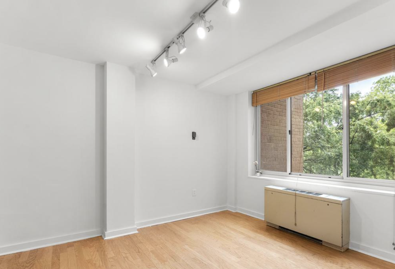 Sunlit Bedroom – Large windows, serene views, and ample space. - 4000 Tunlaw Rd NW