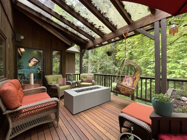 Building Photo - One-of-a-Kind Custom Home with Wall of Windows, Stone Fireplaces, Expansive Entertainment Space &...