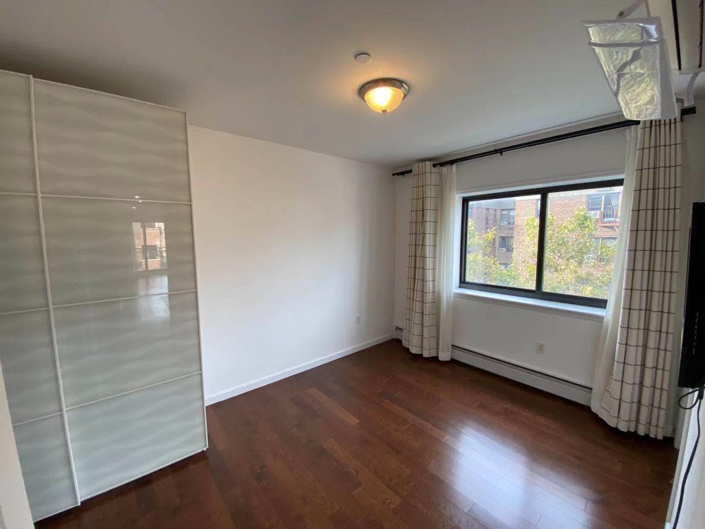 Master Bedroom facing window - 9411 65th Rd