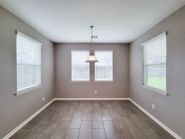 Building Photo - Welcome to this charming one-story home fe...