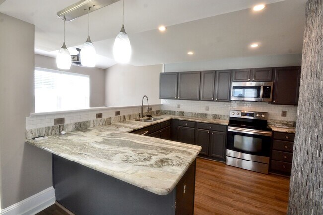 Building Photo - Stunning and Beautifully Updated Twin Home 3 Bedroom - Fenced In Backyard with a Basketball Court