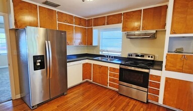 Building Photo - Wonderful 60s Throwback 2/2 on large corner lot with fenced yard