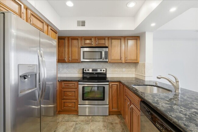 Building Photo - "Luxurious 2-Bed Condo with, loft, Granite Elegance & Hardwood Charm in Reston, VA!"