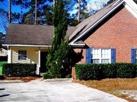Building Photo - Updated flooring, McClelland Town homes 2BR/2Bath one level patio home, with back court yard! Clo...
