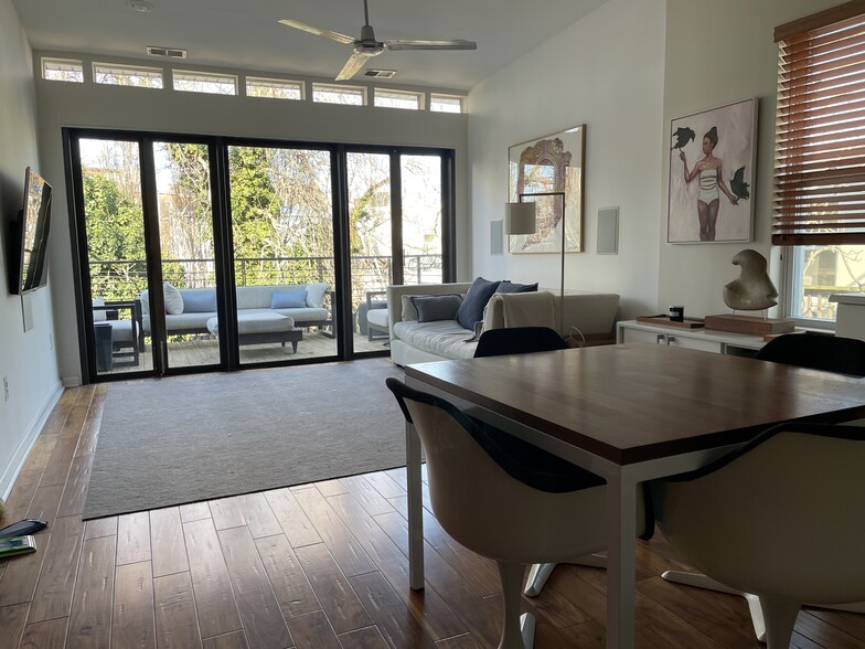View from the open plan kitchen, to the living room and on to the patio deck. - 1003 P St NW