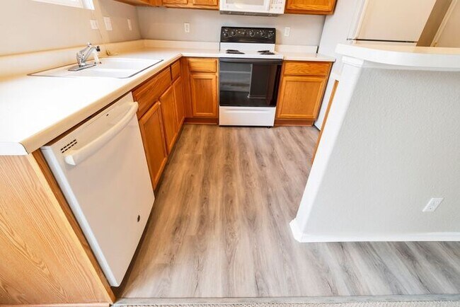 Building Photo - 3BR Townhome Near DIA & Light Rail | New Carpet, Garage & Fenced Patio