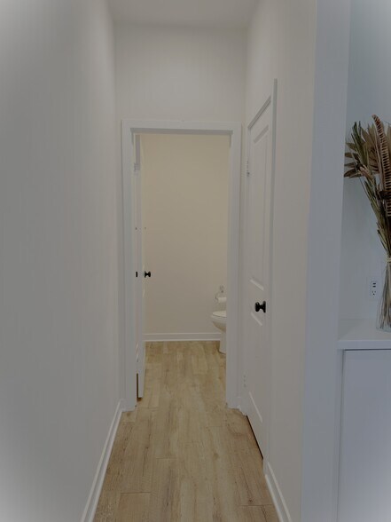 Hallway to half-bath/powder & storage closet - 2729 Sunrise Way