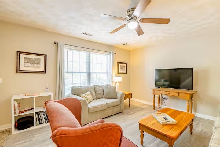 Living area has couch, love seat and arm chair with 50" smart tv. - 515 School Ln