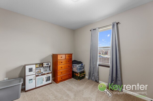 Building Photo - Spacious 4-Bedroom Home with Finished Basement & 3-Car Garage – Derby, KS