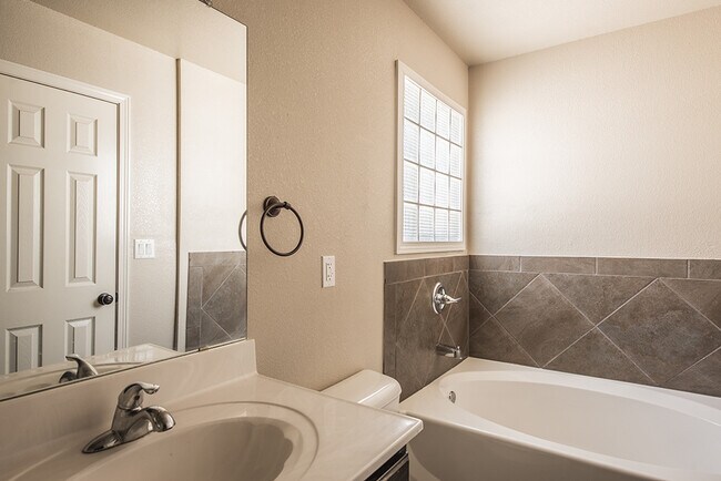 Building Photo - Beautiful 4-Bedroom Home with Custom Backy...