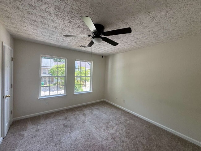 Building Photo - Built in 2004, this two-story townhouse in the Wellington Walk community offers 1,205 square feet...