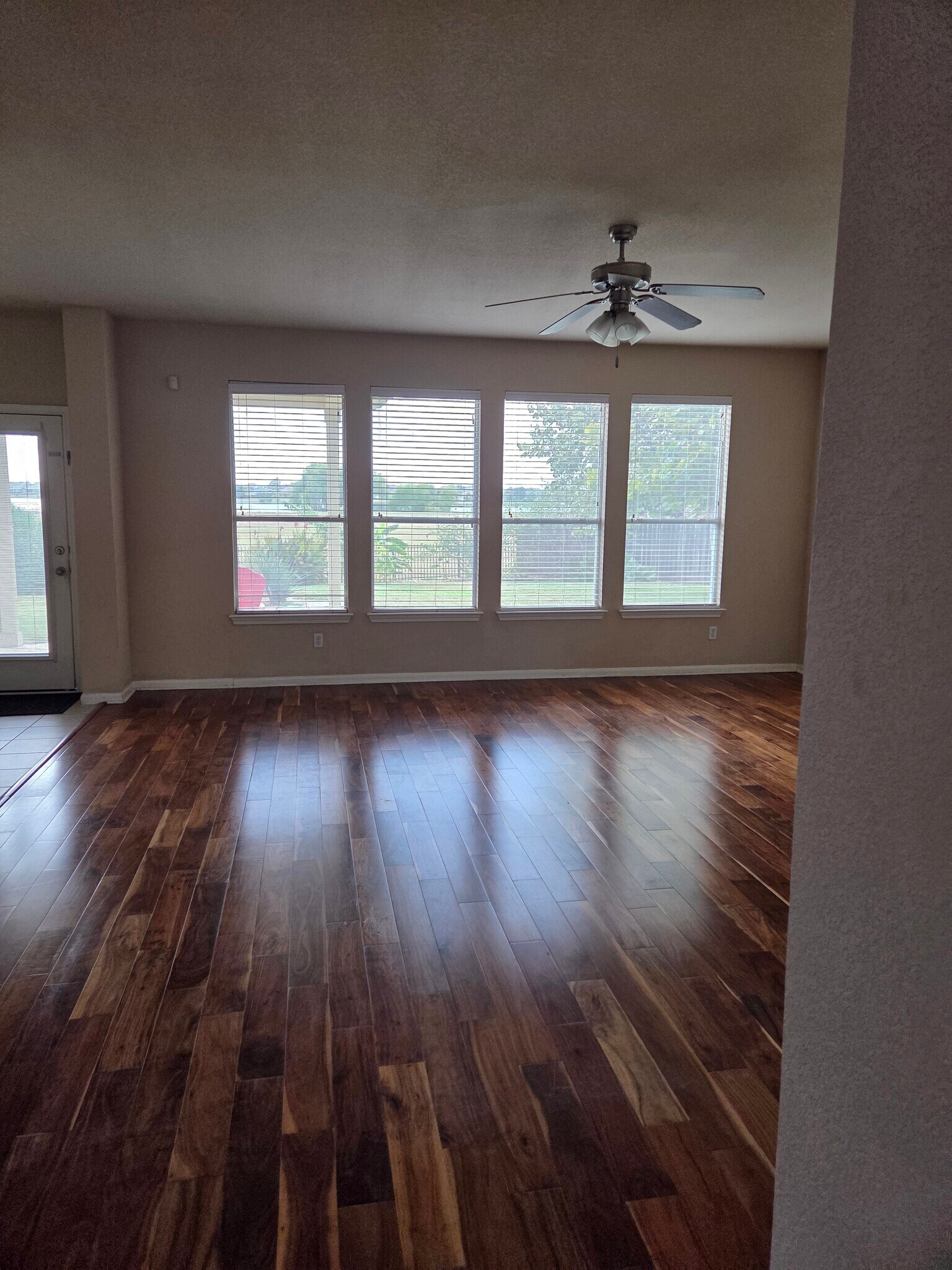 Living Room. Windows facing lake - 18204 Kermit Ct