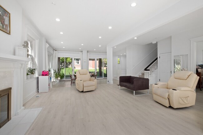 Large, open living room with views of backyard. - 31 Dartford Ave