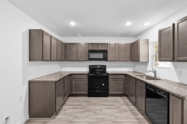 Building Photo - For lease in the sought-after Cedar Point community, this delightful home boasts 1,065 square fee...