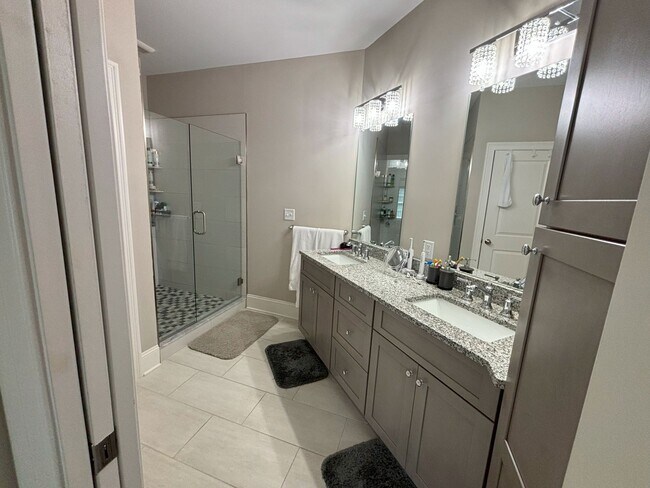 Main floor, bathroom in main bedroom suite. Full bath with standing shower. - 140 Wells View Rd