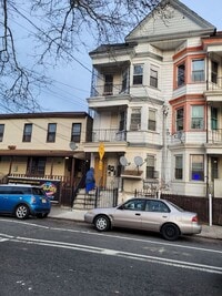 Building Photo - 3 bedrooms on the 3rd Floor with Central Hot Air, and an Available backyard