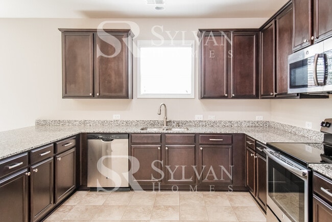 Building Photo - Embrace the charm of this 4 BR, 2.5 BA home