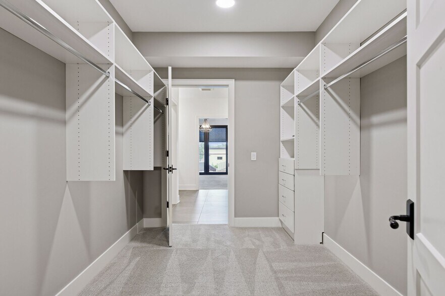 Large walk-in closet with built-in components to help you stay organized - 222 Ferndale Rd S