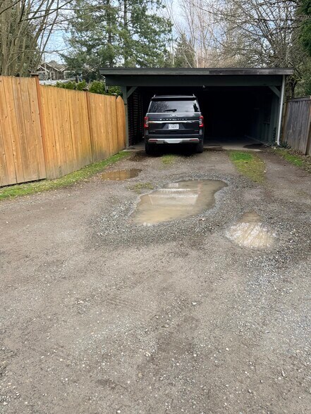 Shared carport. Left side, tandem 2 cars - 10734 35th Ave NE