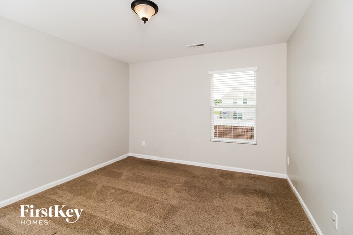 Building Photo - 6608 Championship Dr