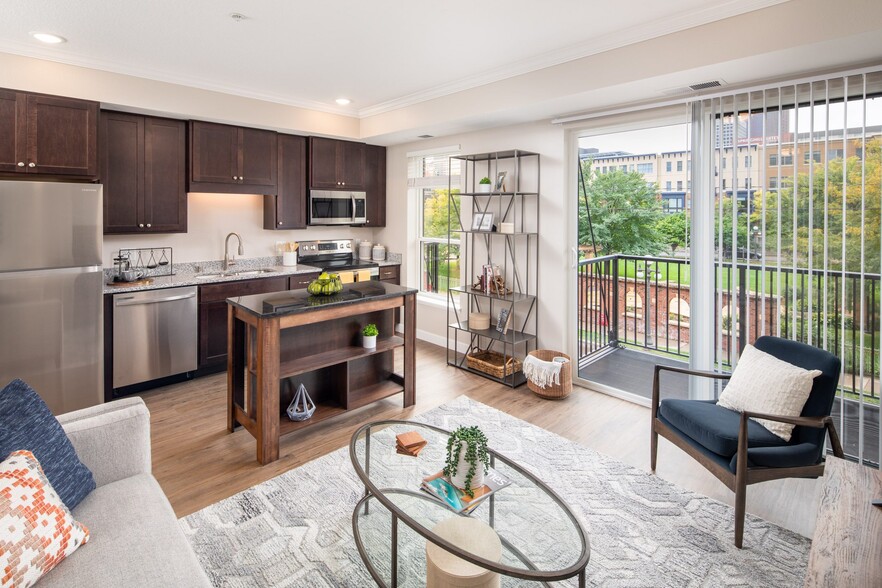 View of modern living room and kitchen area at The Whitley - The Whitley