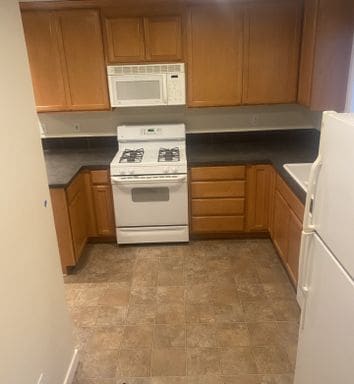 Building Photo - LIKE NEW three bedroom with fantastic updates, one car garage and private newly fenced front patio!