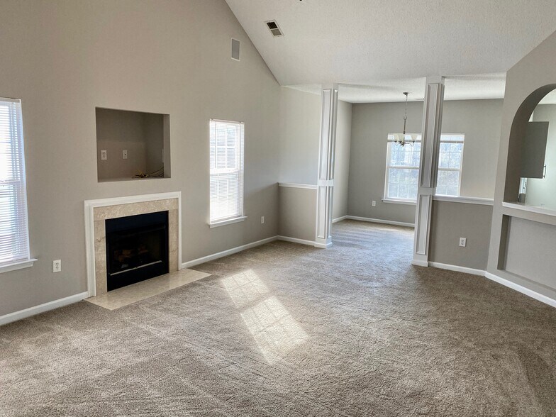 Natural gas fireplace in great room with direct access to open concept dining room! - 1914 Conifer Cir