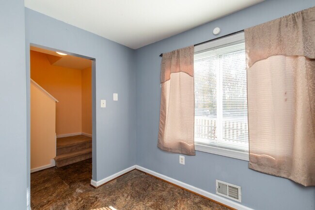 Building Photo - Spacious end-unit three-level townhome featuring 2 bedrooms and 2.5 bathrooms