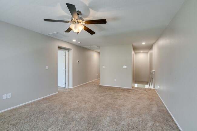 Building Photo - Spacious Townhouse with Loft & Rare 3-Car Garage!