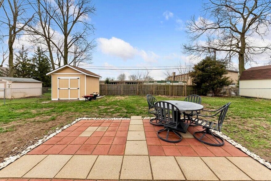 Charming patio for morning coffee, entertaining! Fully fenced back yard with storage shed! - 11 Lawndale Ave