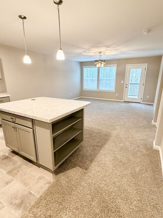 Building Photo - Exquisite brand new condo w/everything! Ground floor, no stairs, attached garage