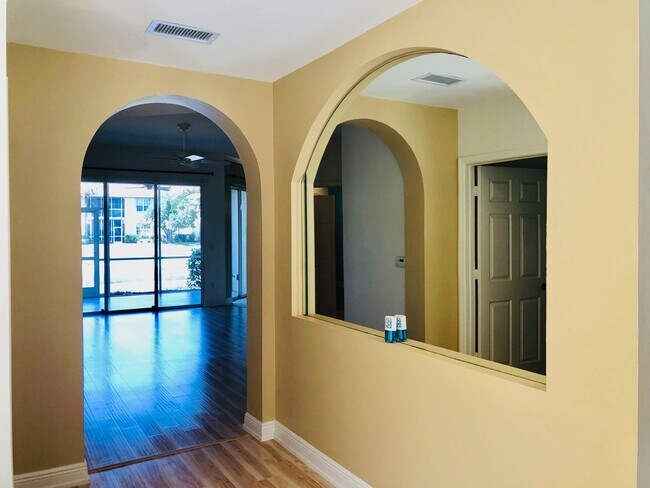 Building Photo - Experience Bell Tower Park. GATED ground floor 2 Bed 2 Bath Den 1 Car Garage Condo.