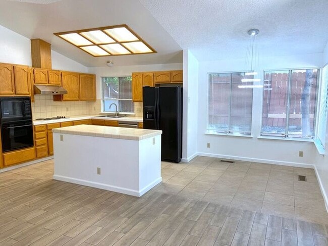 Building Photo - Coming Up Roses - NW Reno 4 Bedroom/3 Car Garage Single Story House