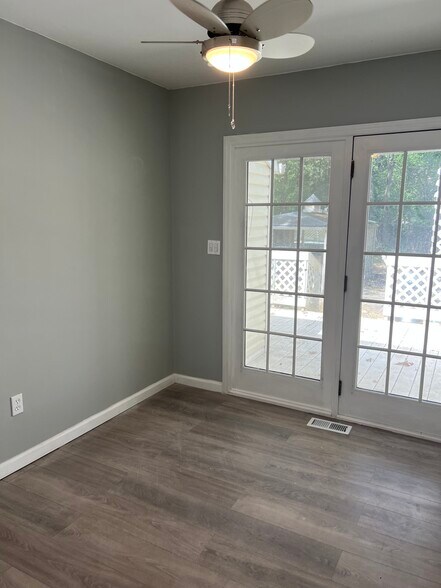 Beutiful bedroom , built in closet brand new flooring and molding with glass doors leading to deck - 161 Ronald Rd